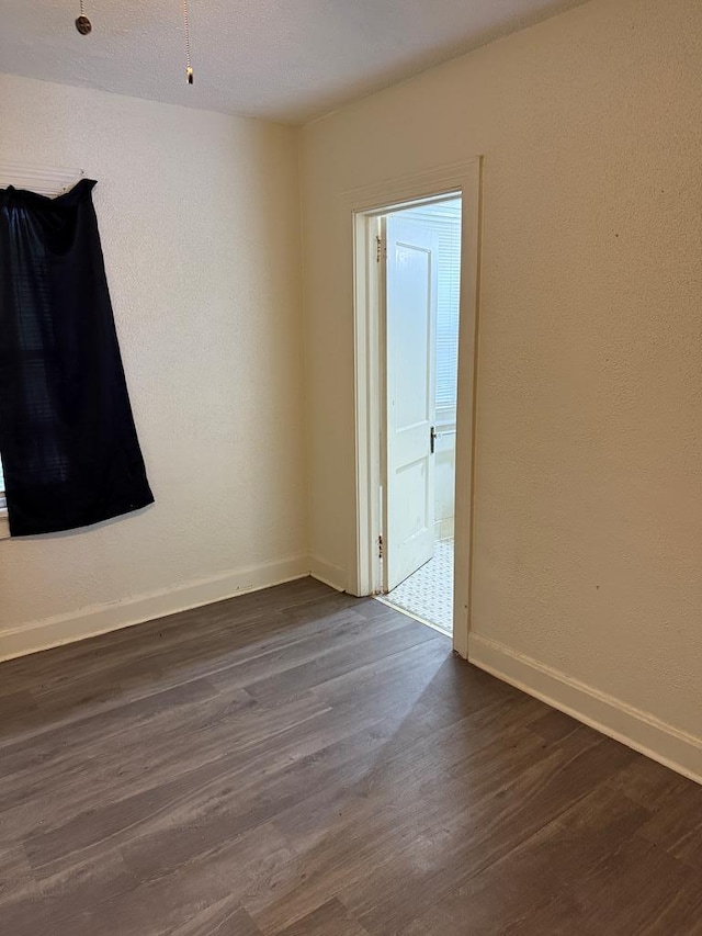 2436 Schaul St, Columbus, GA 31906 - spare room featuring baseboards and dark wood-type flooring