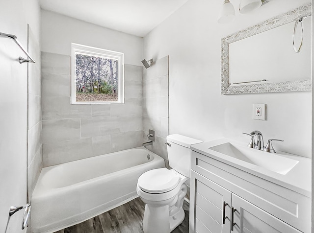 full bathroom with vanity, shower / washtub combination, wood finished floors, and toilet