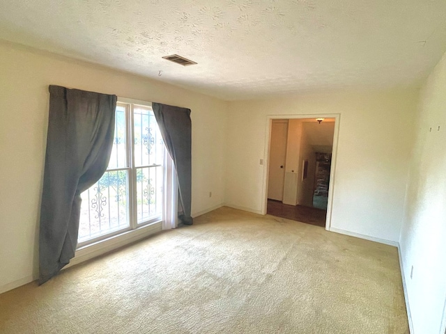 4200 Curry St, Columbus, GA 31907 - spare room featuring light colored carpet and a textured ceiling