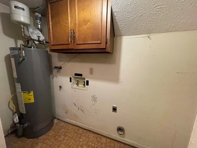 4200 Curry St, Columbus, GA 31907 - laundry room with water heater, electric dryer hookup, cabinet space, washer hookup, and tile patterned floors