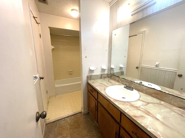 4200 Curry St, Columbus, GA 31907 - full bath featuring vanity, tile patterned flooring,  shower combination, and a textured ceiling