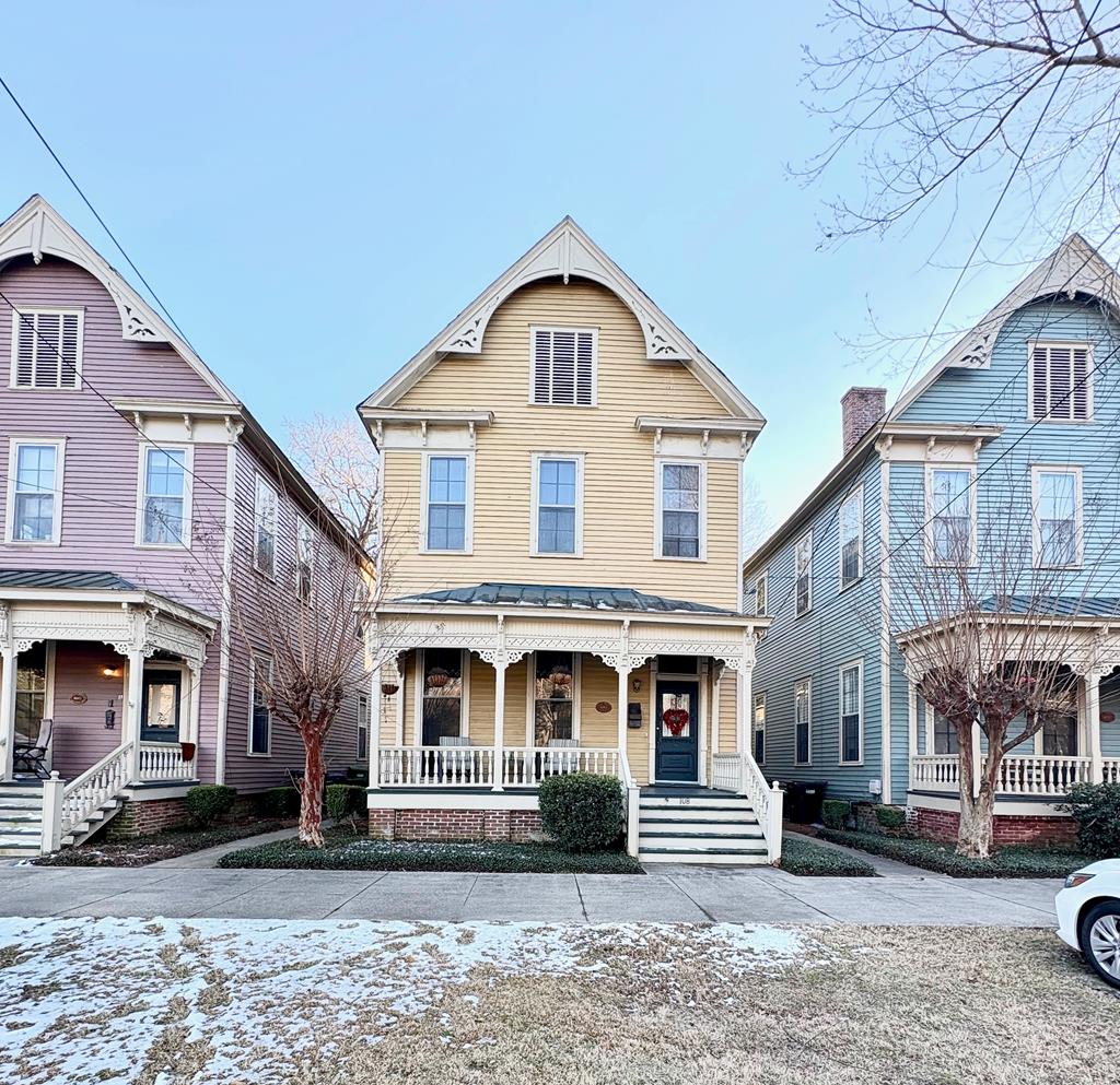 victorian house featuring a porch