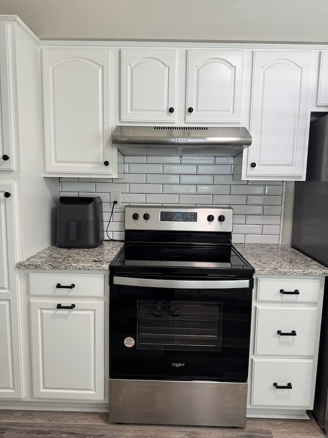 4901 Willowbrook Dr, Columbus, GA 31909 - kitchen featuring stainless steel range with electric stovetop, under cabinet range hood, decorative backsplash, and white cabinets