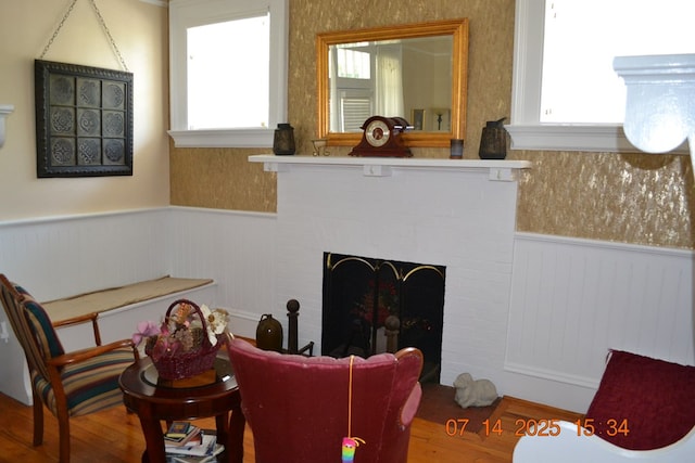 2901 Beacon Ave, Columbus, GA 31904 - living area with a wainscoted wall, wood finished floors, and a fireplace