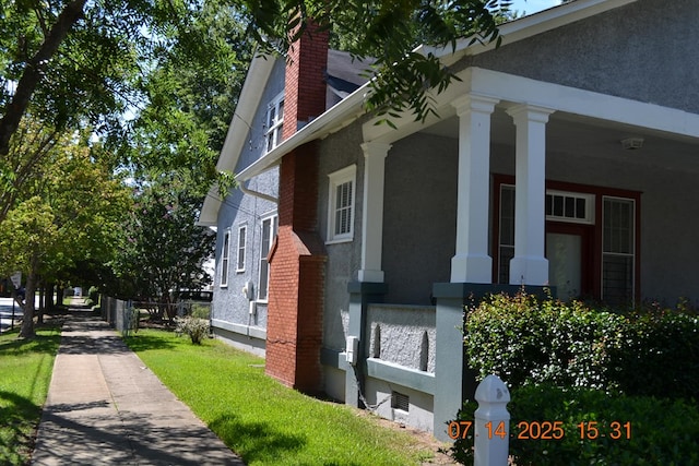 2901 Beacon Ave, Columbus, GA 31904 - view of property exterior featuring stucco siding and a chimney