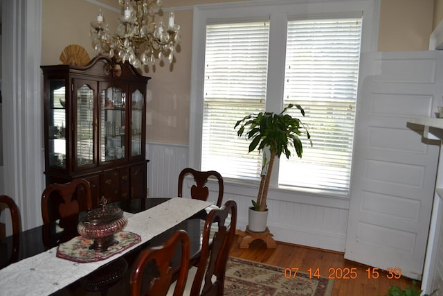 2901 Beacon Ave, Columbus, GA 31904 - dining room with a chandelier, wainscoting, and wood finished floors
