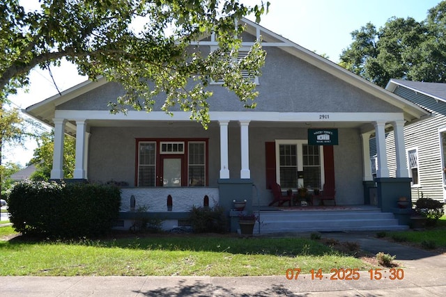 2901 Beacon Ave, Columbus, GA 31904 - view of front facade featuring a porch, stucco siding, and a front yard