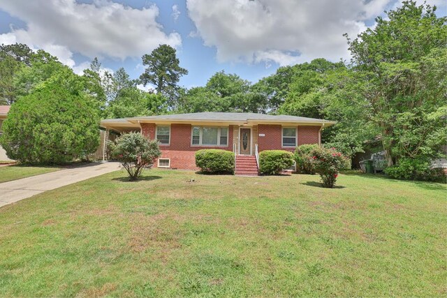 4657 Pate Dr, Columbus, GA 31907 - ranch-style home featuring driveway, a carport, a front yard, and brick siding