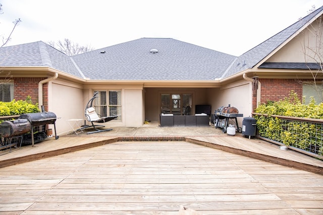 wooden terrace featuring grilling area