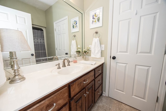 bathroom featuring tile patterned floors and vanity