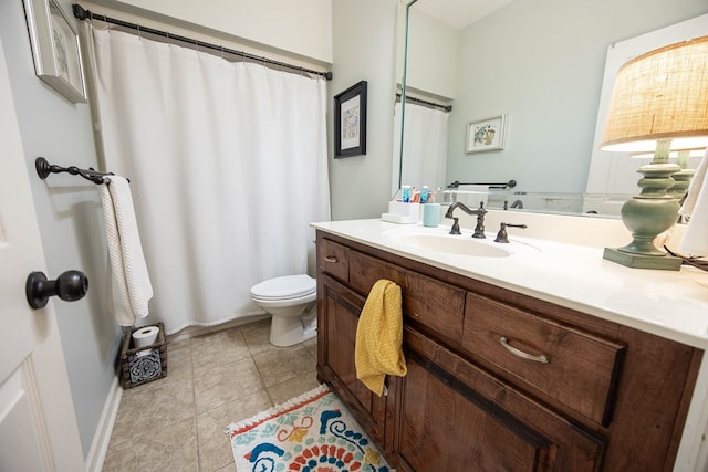 bathroom featuring vanity, curtained shower, toilet, and tile patterned flooring