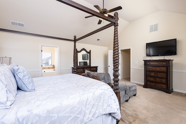 carpeted bedroom with connected bathroom, ceiling fan, and vaulted ceiling