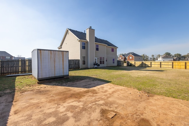 exterior space featuring a shed and a lawn