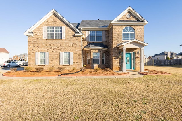 front facade featuring a front yard