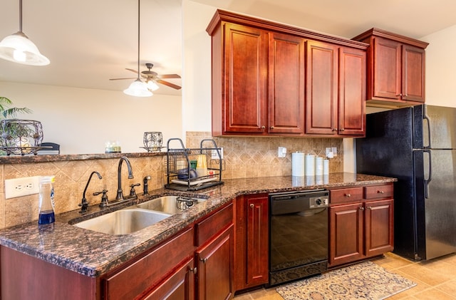 kitchen featuring tasteful backsplash, black appliances, sink, dark stone countertops, and hanging light fixtures