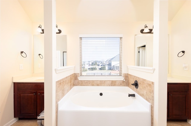 bathroom featuring a tub and vanity