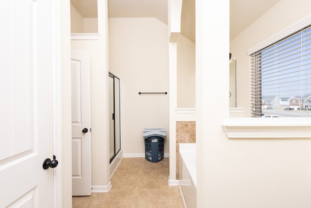 hallway with light tile patterned floors