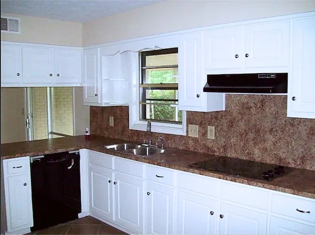 920 Ashland Ave, Columbus, GA 31907 - kitchen with black appliances, under cabinet range hood, and white cabinets