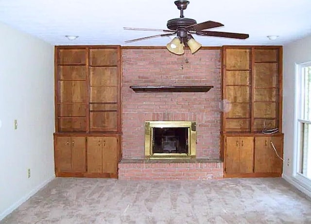 920 Ashland Ave, Columbus, GA 31907 - unfurnished living room with a ceiling fan, a brick fireplace, carpet flooring, and plenty of natural light