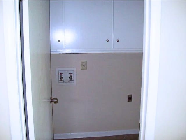 920 Ashland Ave, Columbus, GA 31907 - laundry area with cabinet space, electric dryer hookup, and hookup for a washing machine