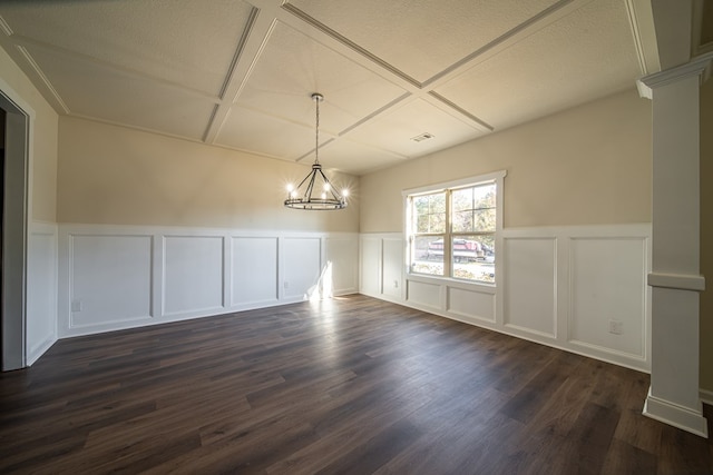 unfurnished dining area with a textured ceiling, dark hardwood / wood-style flooring, and an inviting chandelier