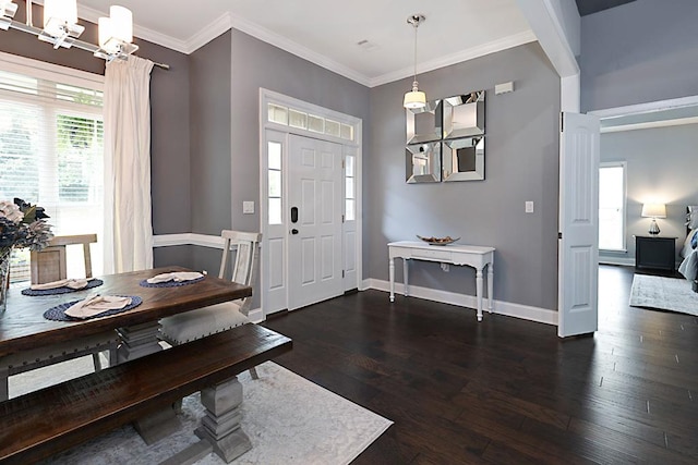1537 Magnolia Way, Columbus, GA 31904 - foyer with dark wood finished floors, a chandelier, and crown molding