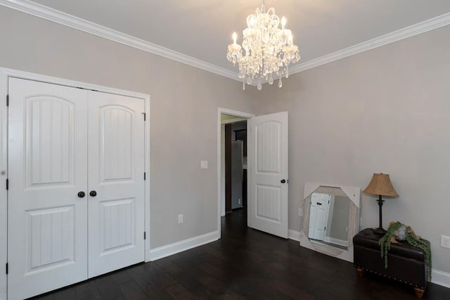 1537 Magnolia Way, Columbus, GA 31904 - bedroom featuring dark wood-style flooring, a chandelier, ornamental molding, and a closet