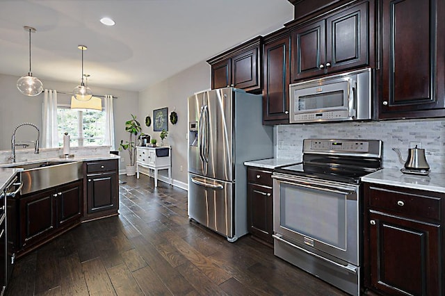 1537 Magnolia Way, Columbus, GA 31904 - kitchen featuring appliances with stainless steel finishes, dark wood finished floors, tasteful backsplash, dark brown cabinetry, and recessed lighting