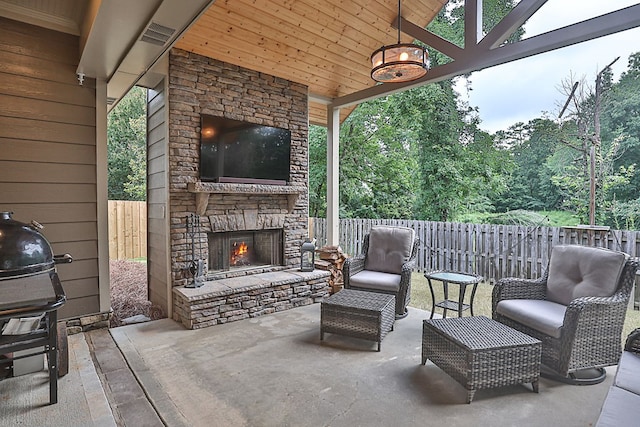 1537 Magnolia Way, Columbus, GA 31904 - fenced backyard featuring an outdoor stone fireplace, a grill, and a patio area