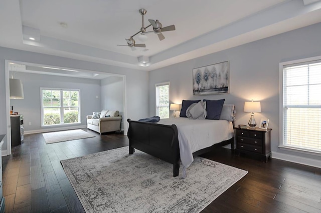 1537 Magnolia Way, Columbus, GA 31904 - bedroom with a tray ceiling, dark wood-style flooring, and a ceiling fan