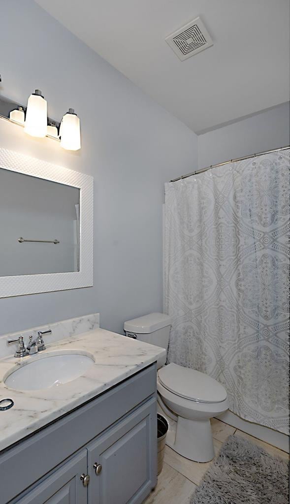 1537 Magnolia Way, Columbus, GA 31904 - bathroom with vanity and a shower with shower curtain