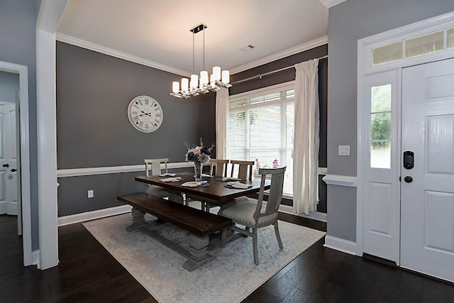 1537 Magnolia Way, Columbus, GA 31904 - dining room with dark wood-style floors, ornamental molding, and a chandelier