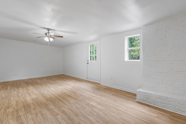 unfurnished room featuring light wood-type flooring and ceiling fan