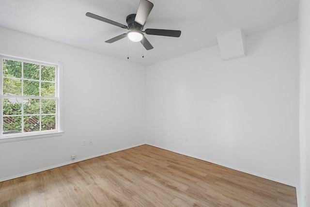 empty room featuring ceiling fan and light hardwood / wood-style floors