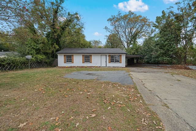 view of front of property featuring a carport and a front lawn