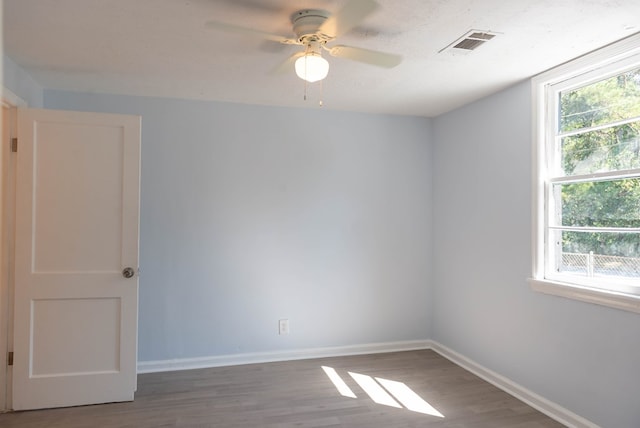 unfurnished room featuring ceiling fan and wood-type flooring