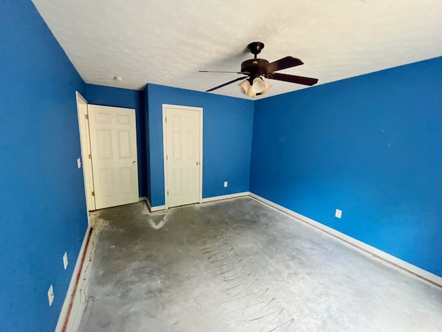 unfurnished bedroom featuring a textured ceiling and ceiling fan