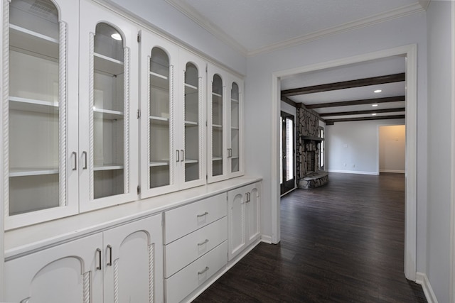 hallway featuring dark wood-style floors, baseboards, beam ceiling, recessed lighting, and ornamental molding