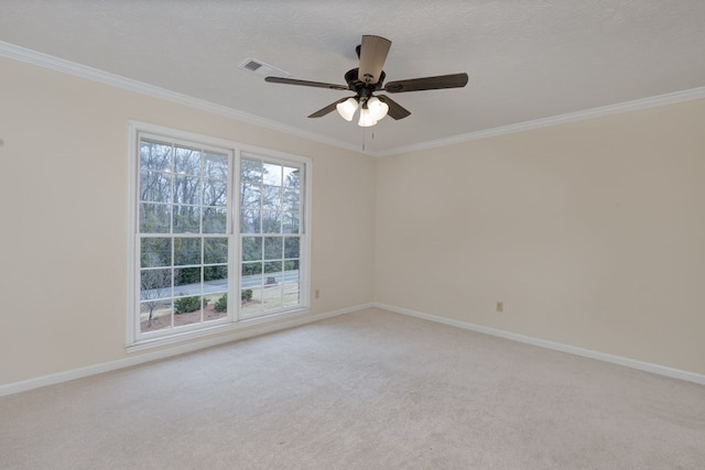 empty room featuring crown molding and light colored carpet