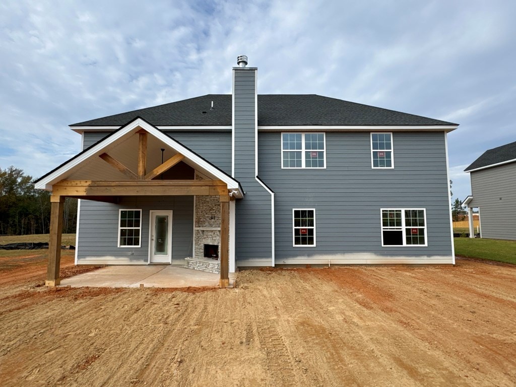 back of property with a patio