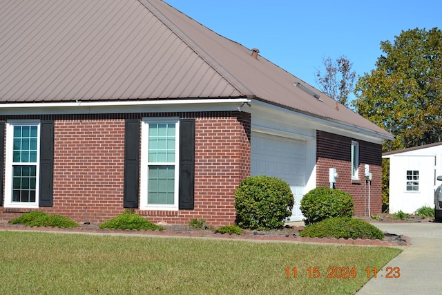 view of side of home featuring a garage