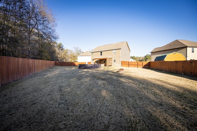 back of house with a yard