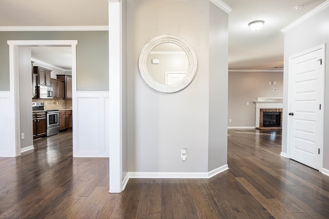 hall featuring ornamental molding and dark hardwood / wood-style floors