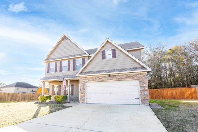 craftsman inspired home with a front lawn and a porch