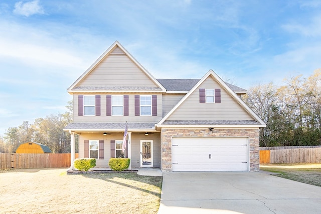 view of front of property with covered porch and a garage