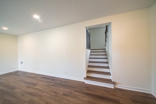 interior space with hardwood / wood-style floors and a textured ceiling