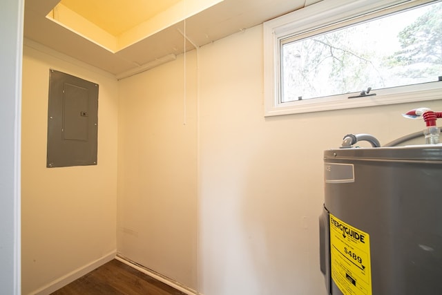 interior space featuring electric panel and water heater