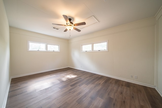 unfurnished room featuring dark hardwood / wood-style flooring, a wealth of natural light, and ceiling fan