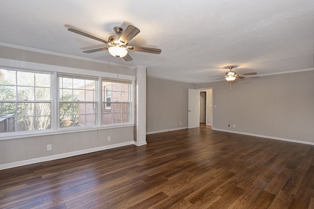 unfurnished room with baseboards, a ceiling fan, dark wood-style floors, a textured ceiling, and crown molding