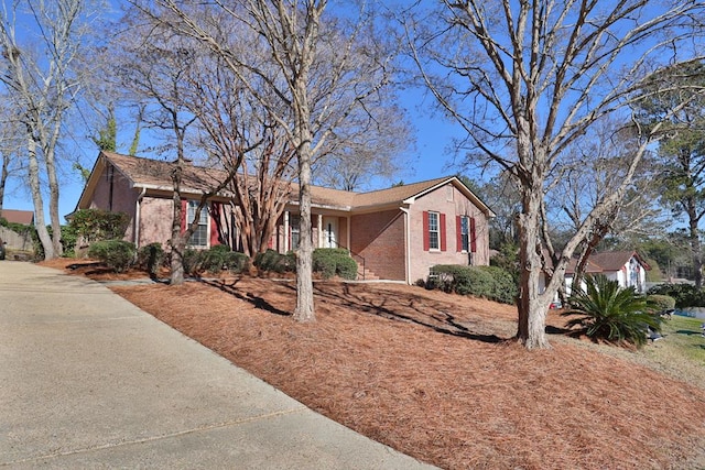 ranch-style house with brick siding